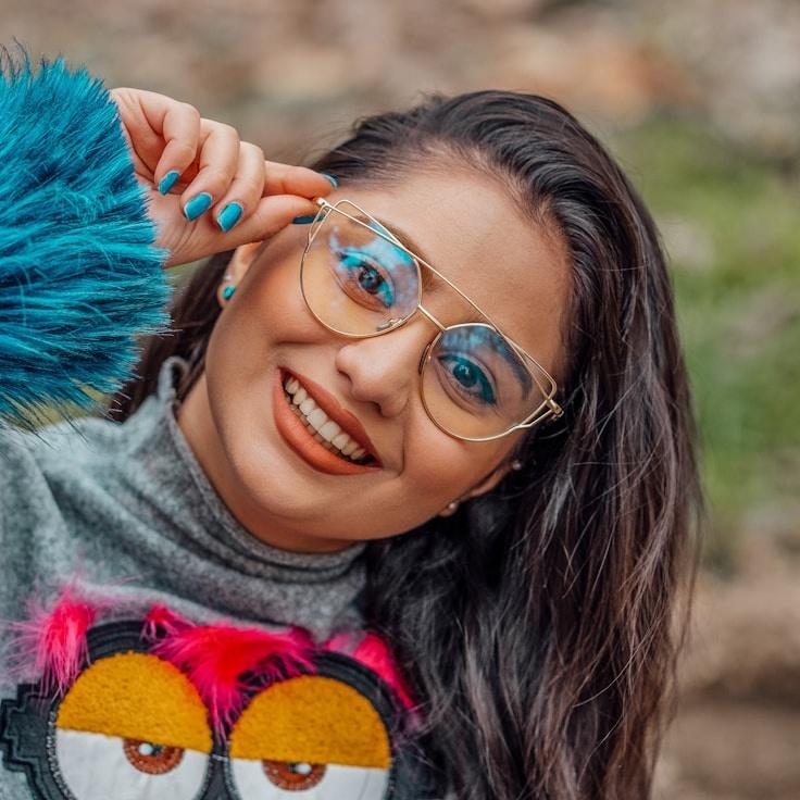 Kaveri Mehta, Lead Design Curator at Cedar Brook Plain, reviewing corporate floral arrangements